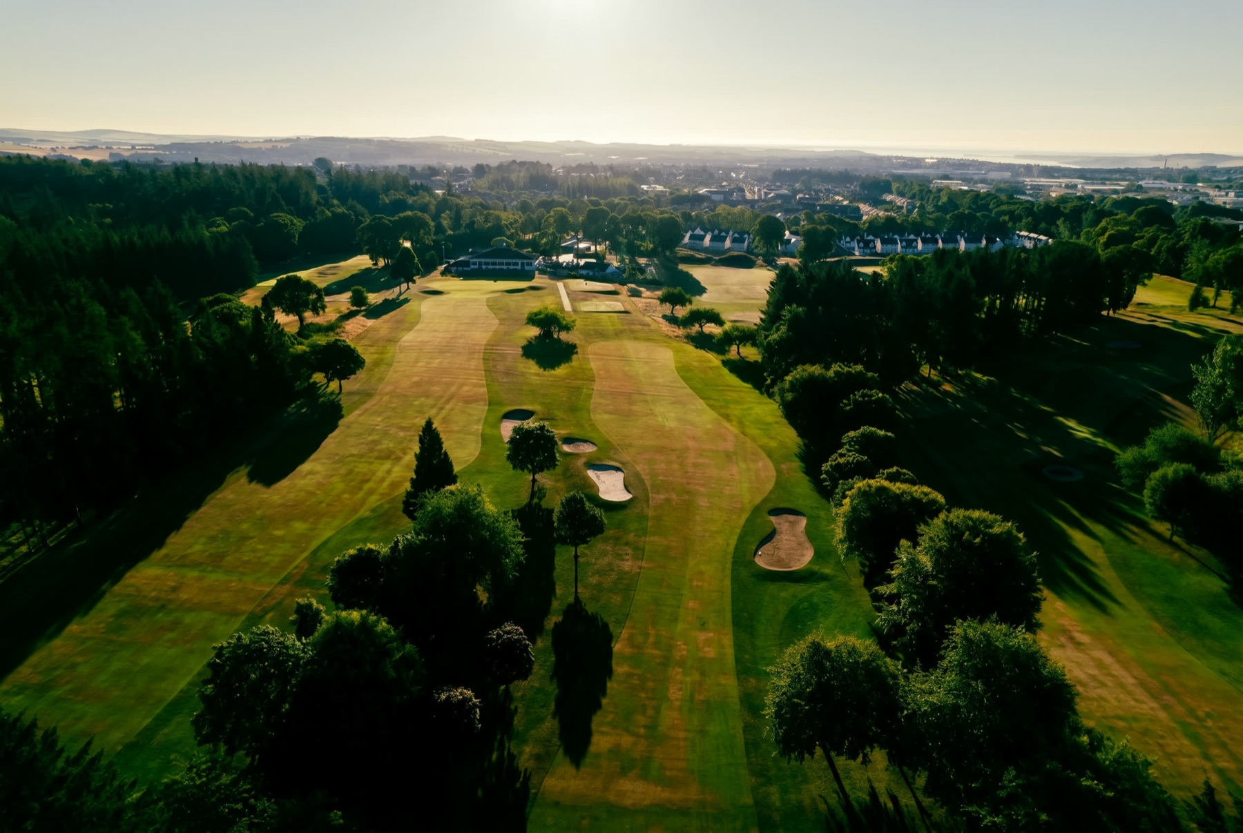 The clubhouse behind the closing hole at Downfield